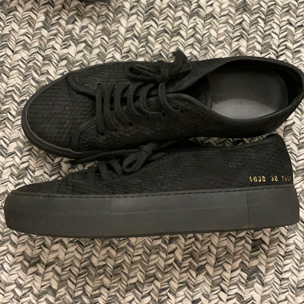 All black common projects with textured suede